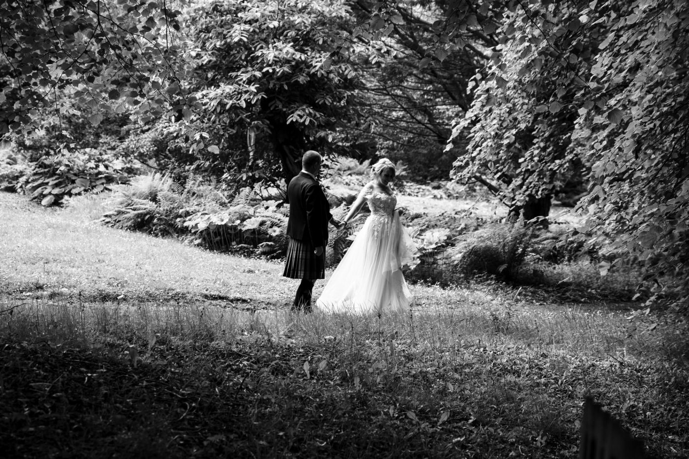 woman in elegant wedding dress man in kilt blog